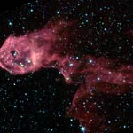a dark cloud of gas and dust in the nearby emission nebula IC1396 brilliantly lit up for the first time.